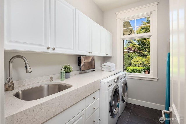 8418SE 44th St, Mercer Island, WA 98040 - washroom featuring cabinet space, washing machine and dryer, dark tile patterned floors, and baseboards