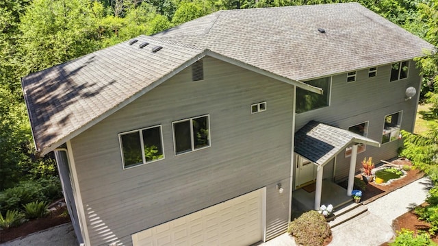 6117 Ames Lake Carnation Rd NE, Carnation, WA 98014 - back of house with an attached garage and a shingled roof