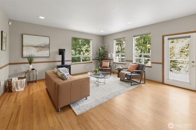 6117 Ames Lake Carnation Rd NE, Carnation, WA 98014 - living area with wood finished floors, plenty of natural light, recessed lighting, and a wood stove
