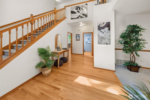 6117 Ames Lake Carnation Rd NE, Carnation, WA 98014 - foyer entrance with wood finished floors, stairs, and a towering ceiling
