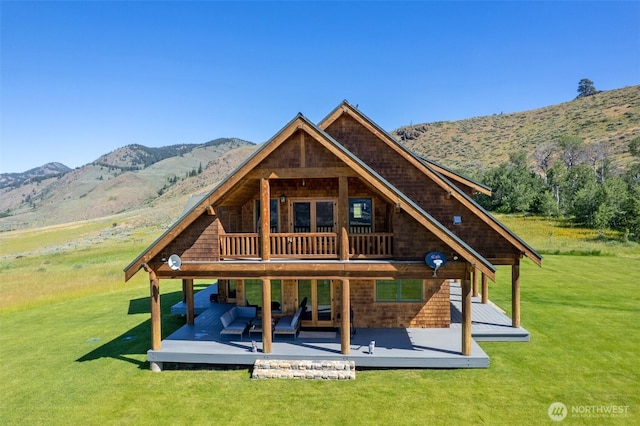 67 Goudy Grade Rd, Winthrop, WA 98862 - back of property featuring a lawn and a deck with mountain view