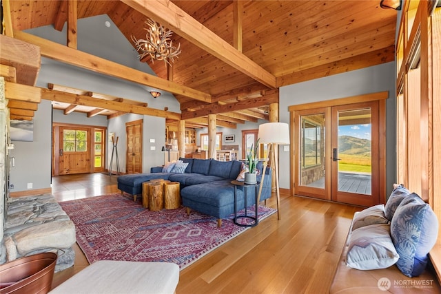 67 Goudy Grade Rd, Winthrop, WA 98862 - living room featuring french doors, a chandelier, and wood finished floors