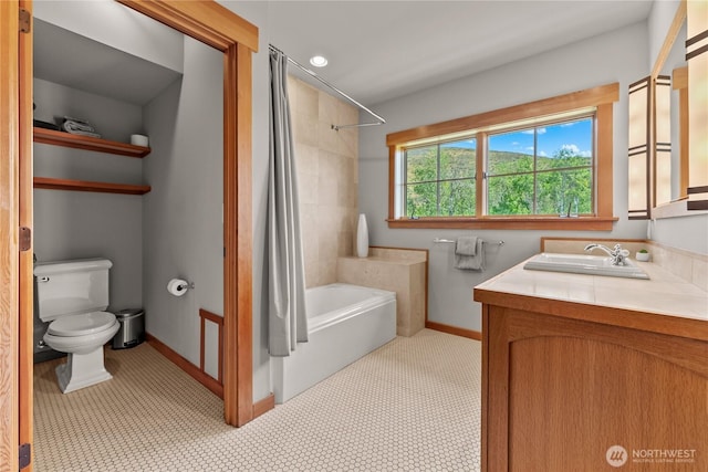 67 Goudy Grade Rd, Winthrop, WA 98862 - full bath with toilet, vanity, shower / bathtub combination with curtain, and baseboards