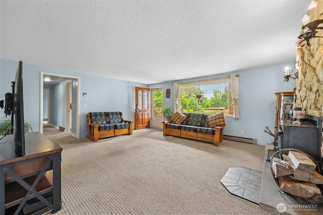 236 Newaukum Valley Rd, Chehalis, WA 98532 - carpeted living room featuring a baseboard radiator and a textured ceiling
