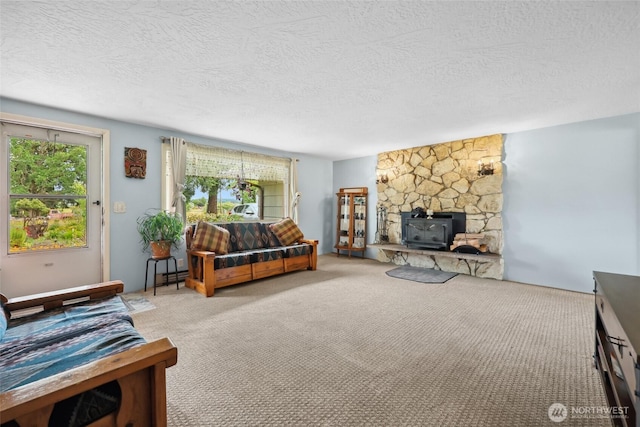 236 Newaukum Valley Rd, Chehalis, WA 98532 - carpeted living room featuring a wood stove and a textured ceiling