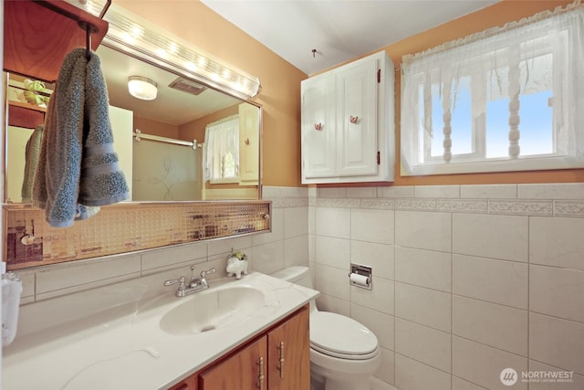 236 Newaukum Valley Rd, Chehalis, WA 98532 - full bathroom with vanity, a shower with door, and a wainscoted wall