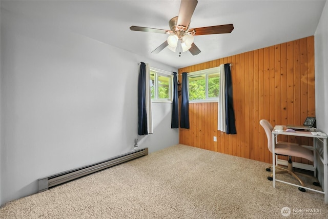 236 Newaukum Valley Rd, Chehalis, WA 98532 - office area featuring a baseboard heating unit, carpet flooring, wood walls, and a ceiling fan