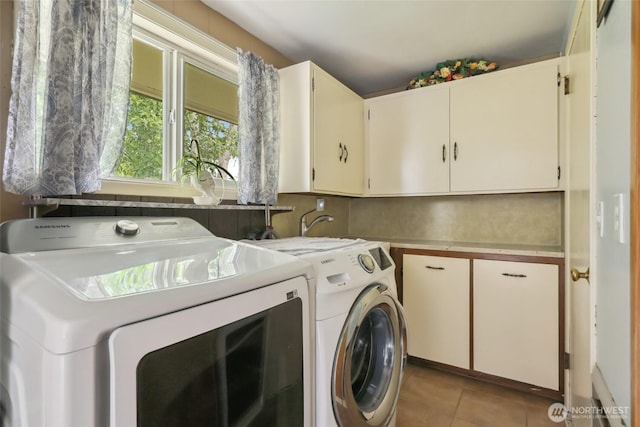236 Newaukum Valley Rd, Chehalis, WA 98532 - laundry area featuring cabinet space, independent washer and dryer, and light tile patterned flooring