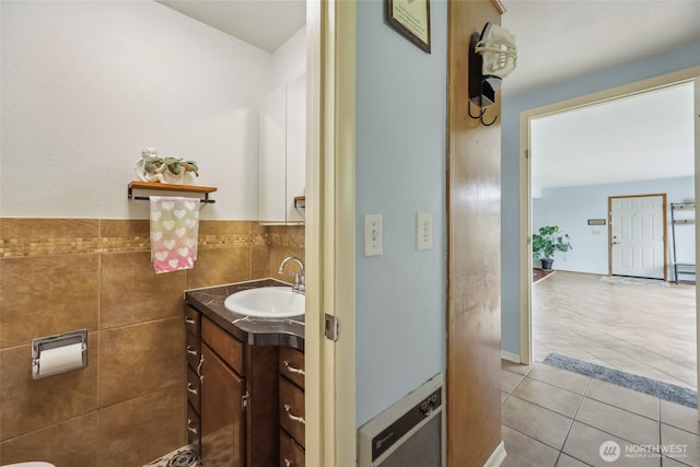 236 Newaukum Valley Rd, Chehalis, WA 98532 - half bathroom featuring vanity, tile patterned floors, and tile walls