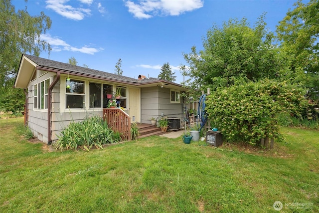 236 Newaukum Valley Rd, Chehalis, WA 98532 - rear view of house featuring a lawn