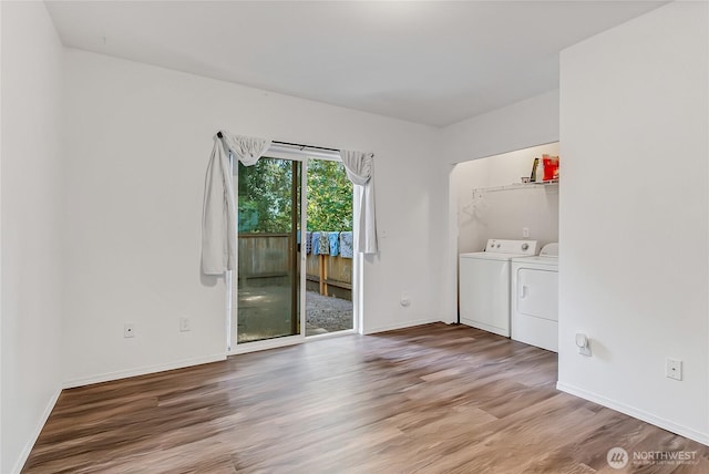 17642 Vine Ln SE, Yelm, WA 98597 - spare room with washer and clothes dryer, light wood-type flooring, and baseboards
