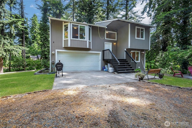 17642 Vine Ln SE, Yelm, WA 98597 - split foyer home featuring concrete driveway, an attached garage, and a front yard