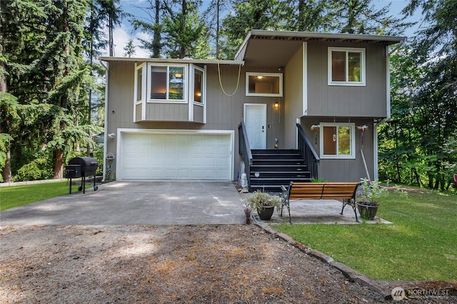 17642 Vine Ln SE, Yelm, WA 98597 - bi-level home with concrete driveway, an attached garage, and a front yard