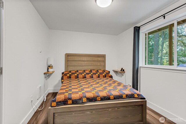 17642 Vine Ln SE, Yelm, WA 98597 - bedroom featuring dark wood finished floors and baseboards