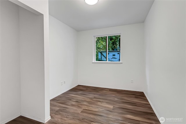 17642 Vine Ln SE, Yelm, WA 98597 - empty room with wood finished floors and baseboards