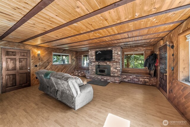 17924 E Clear Lake Blvd SE, Yelm, WA 98597 - living area featuring wooden ceiling, wooden walls, wood finished floors, healthy amount of natural light, and a brick fireplace