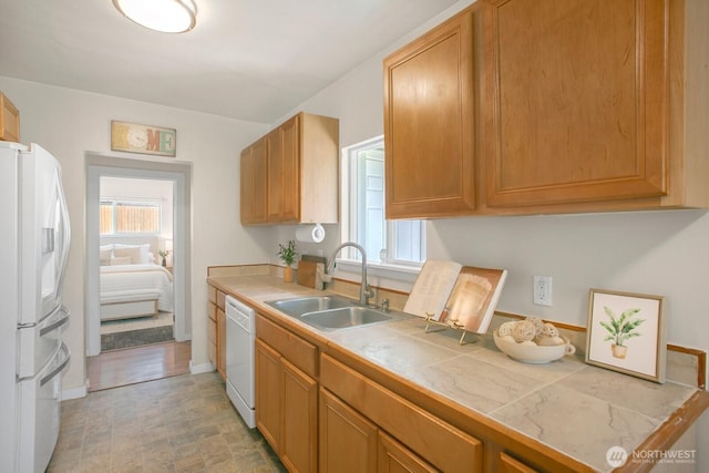 15222 37th Pl S, Tukwila, WA 98188 - kitchen with white appliances, healthy amount of natural light, and tile counters