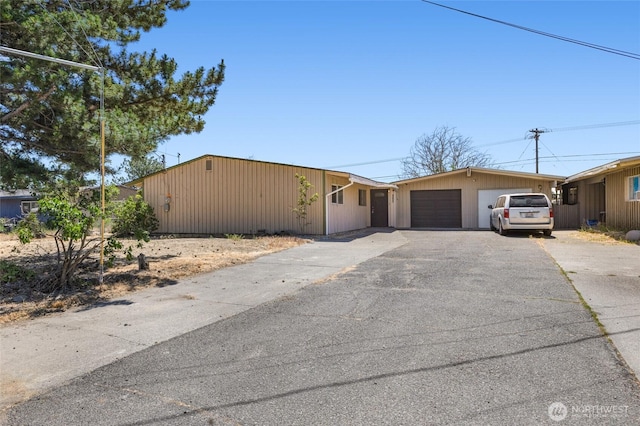 223 Carswell Dr, Moses Lake, WA 98837 - view of front of house featuring driveway and a garage