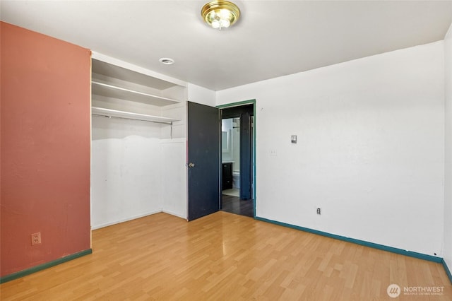 223 Carswell Dr, Moses Lake, WA 98837 - unfurnished bedroom with light wood-style floors, baseboards, and a closet