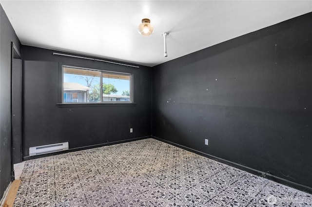223 Carswell Dr, Moses Lake, WA 98837 - empty room with a baseboard heating unit