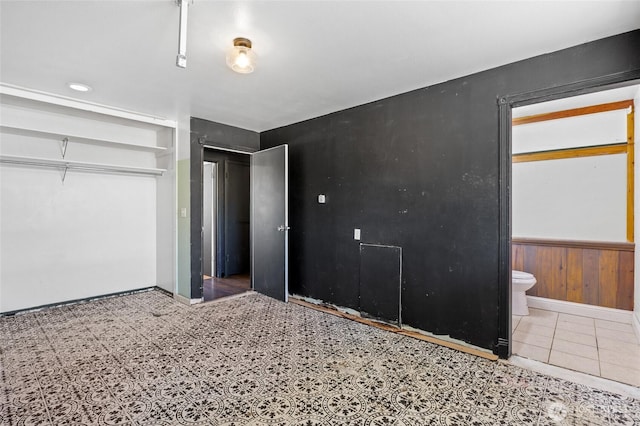 223 Carswell Dr, Moses Lake, WA 98837 - unfurnished bedroom with a closet, ensuite bathroom, and baseboards