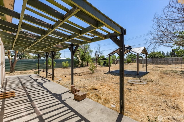 223 Carswell Dr, Moses Lake, WA 98837 - fenced backyard featuring a pergola, a gazebo, and a patio