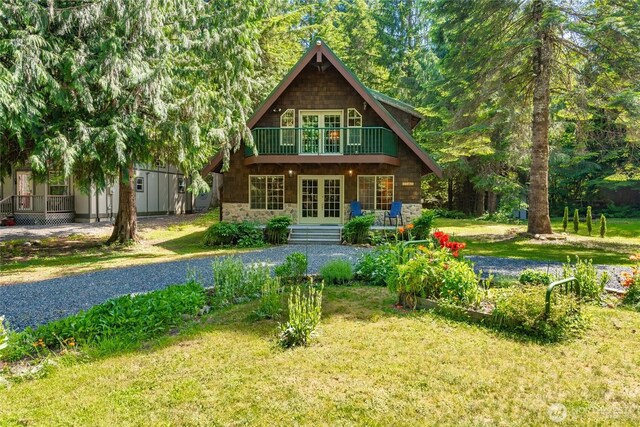 14030 Shuksan Rim Dr, Glacier, WA 98244 - rear view of property with french doors, stone siding, and a yard
