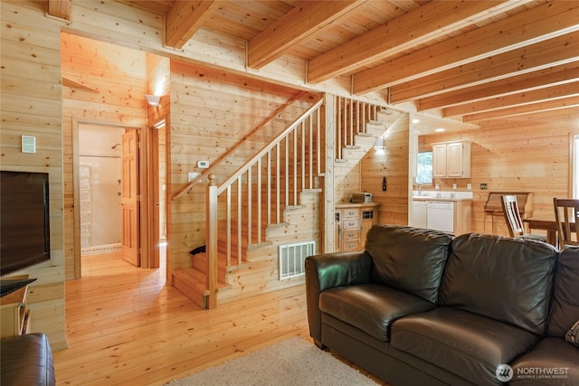 14030 Shuksan Rim Dr, Glacier, WA 98244 - living room featuring wooden walls, a wooden ceiling with exposed beams, stairway, and light wood-style floors