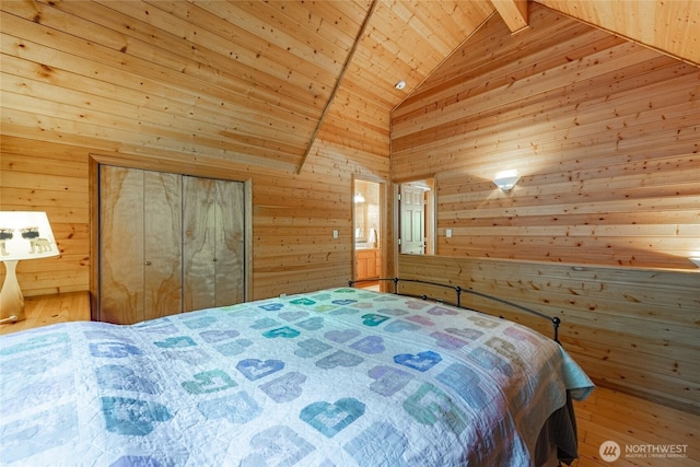 14030 Shuksan Rim Dr, Glacier, WA 98244 - bedroom with wooden walls, wood ceiling, light wood-style floors, and a closet