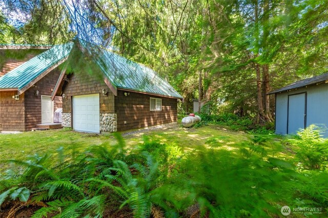 14030 Shuksan Rim Dr, Glacier, WA 98244 - view of grassy yard with an outbuilding and a detached garage