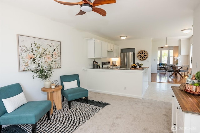 2029 S Charles St, Seattle, WA 98144 - sitting room featuring a ceiling fan and light colored carpet