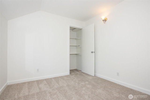 2029 S Charles St, Seattle, WA 98144 - unfurnished bedroom with carpet, a closet, and vaulted ceiling