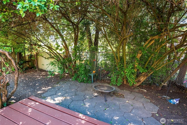 2029 S Charles St, Seattle, WA 98144 - fenced backyard with a patio and an outdoor fire pit