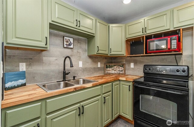 8805 11th St NE, Lake Stevens, WA 98258 - kitchen featuring black electric range oven, green cabinets, wooden counters, and a sink