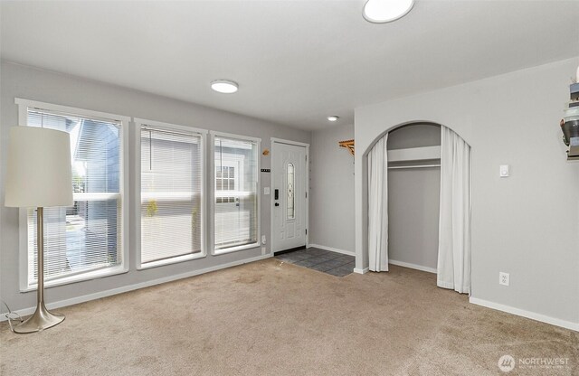 8805 11th St NE, Lake Stevens, WA 98258 - carpeted entrance foyer with baseboards and arched walkways