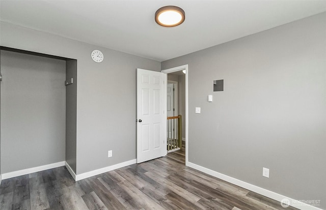 8805 11th St NE, Lake Stevens, WA 98258 - unfurnished bedroom with baseboards and wood finished floors