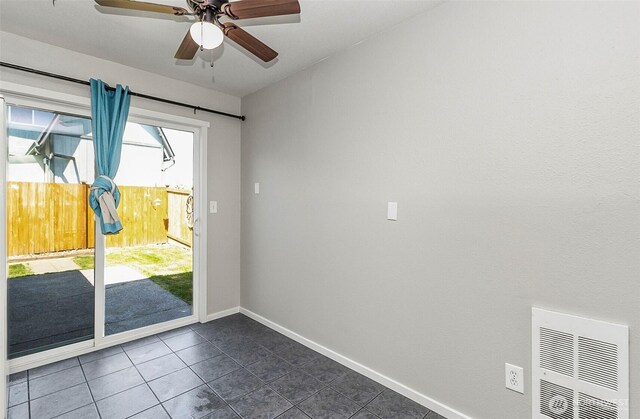 8805 11th St NE, Lake Stevens, WA 98258 - entryway with a ceiling fan, dark tile patterned floors, and baseboards