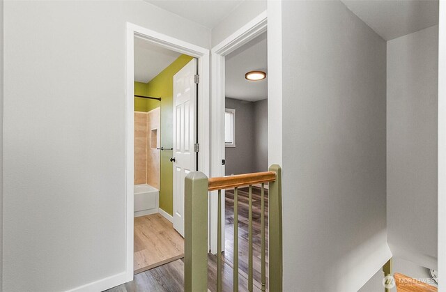 8805 11th St NE, Lake Stevens, WA 98258 - hallway with an upstairs landing, wood finished floors, and baseboards
