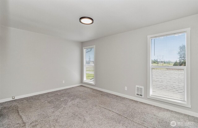 8805 11th St NE, Lake Stevens, WA 98258 - carpeted spare room with baseboards