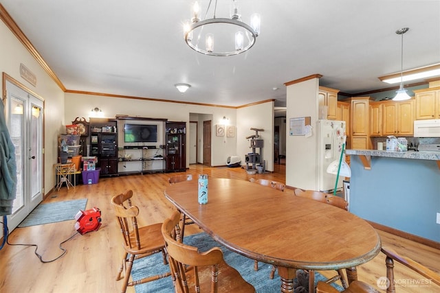 8080 Mosey Ct, Maple Falls, WA 98266 - dining area featuring a chandelier, ornamental molding, and light wood-style floors