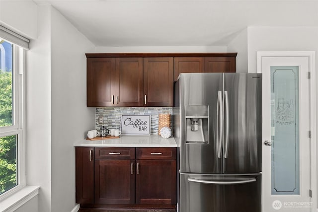 4109 Ingleside Loop SE, Lacey, WA 98503 - kitchen featuring stainless steel fridge with ice dispenser, light countertops, and tasteful backsplash