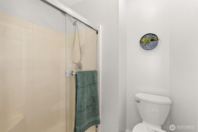 4109 Ingleside Loop SE, Lacey, WA 98503 - full bathroom featuring tiled shower and toilet