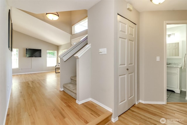 913 N Mountain View Ave, Tacoma, WA 98406 - corridor with light wood-type flooring, stairway, and vaulted ceiling