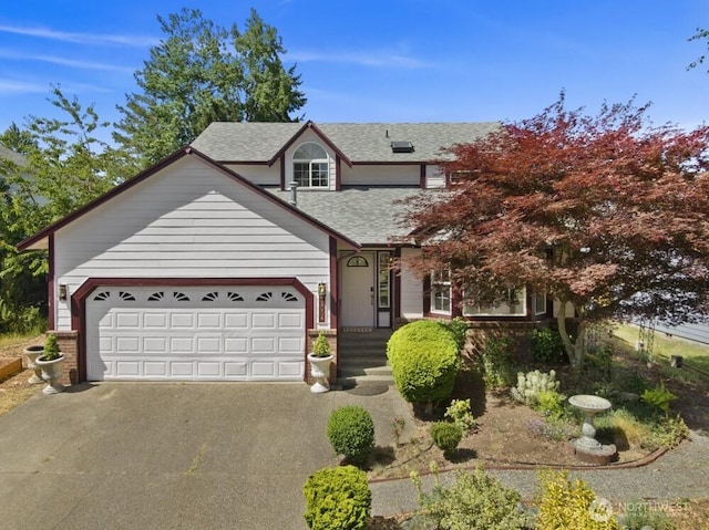 2004 15th Ave SW, Olympia, WA 98502 - traditional-style house with driveway, roof with shingles, an attached garage, and brick siding