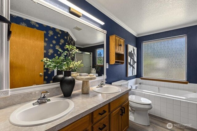 2004 15th Ave SW, Olympia, WA 98502 - full bath featuring wood finished floors, a bath, double vanity, a textured ceiling, and a stall shower