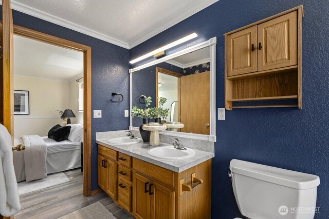 2004 15th Ave SW, Olympia, WA 98502 - full bath with wood finished floors, crown molding, ensuite bath, double vanity, and a textured wall
