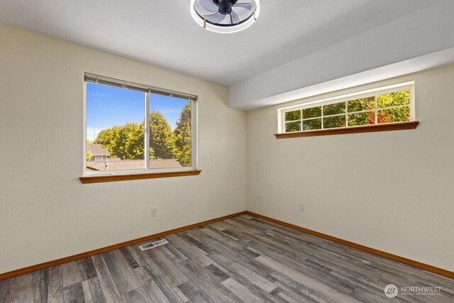 2004 15th Ave SW, Olympia, WA 98502 - empty room featuring wood finished floors and baseboards