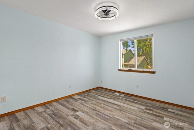 2004 15th Ave SW, Olympia, WA 98502 - unfurnished room featuring wood finished floors