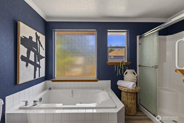 2004 15th Ave SW, Olympia, WA 98502 - bathroom featuring a textured ceiling, crown molding, a shower stall, a whirlpool tub, and wood finished floors
