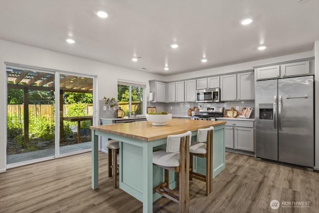 1709 Fern St SW, Olympia, WA 98502 - kitchen with stainless steel appliances, gray cabinets, butcher block countertops, light wood-type flooring, and recessed lighting